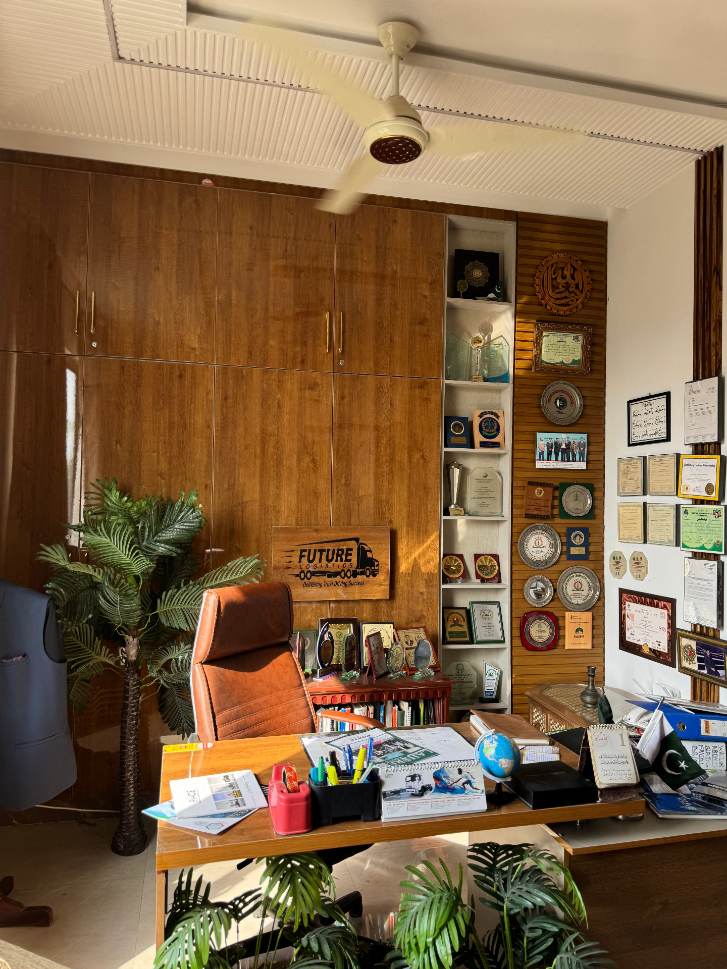 Future Logistics head office interior with awards wall and executive workspace, Lahore